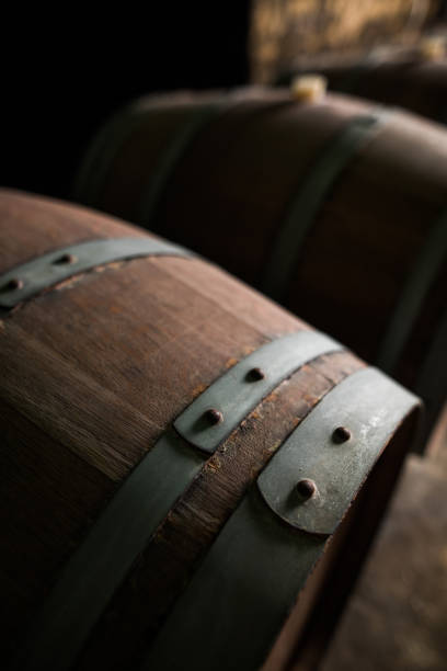 istock Wooden barrels in a dark cellar 1179514418