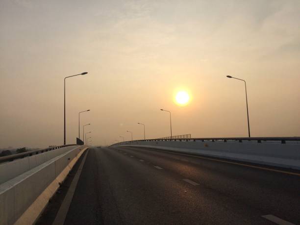 istock morning sun on the road 1179515225