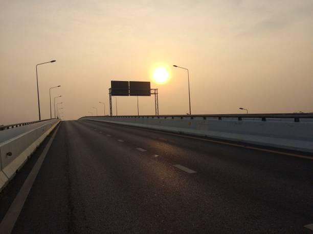 istock morning sun on the road 1179515226