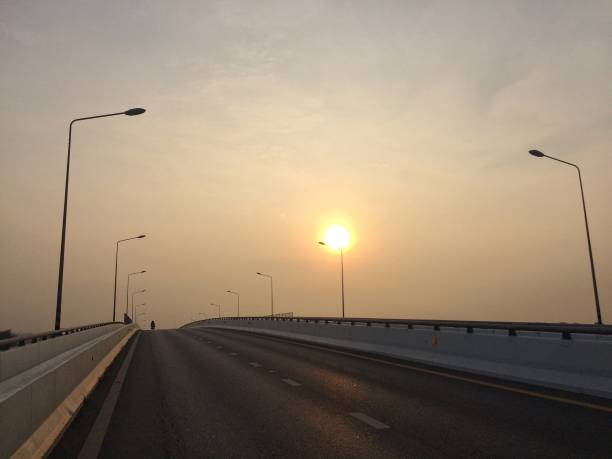 istock morning sun on the road 1179515227