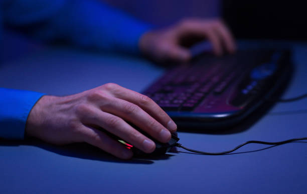istock Man playing video games on desktop pc at home 1179517791