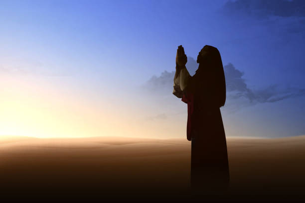 istock Jesus Christ raised hands and praying to god 1179518955