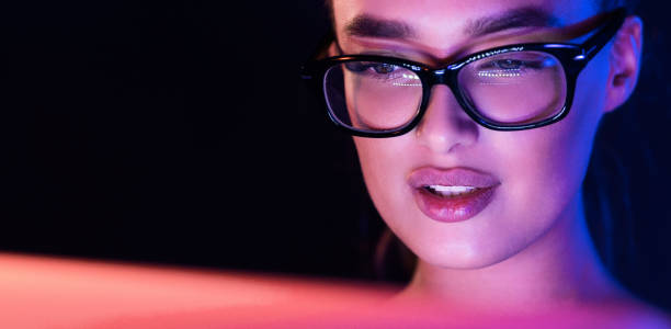 istock Serious woman working on laptop late at night 1179519078