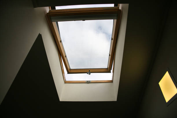 istock Window in the ceiling. Blue sky with clouds. Attic interior. 1179519490