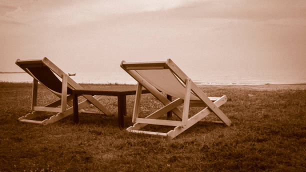 istock Empty deck chair. Beautiful color chairs on the beach. Blue sky vacation holiday. 1179519497