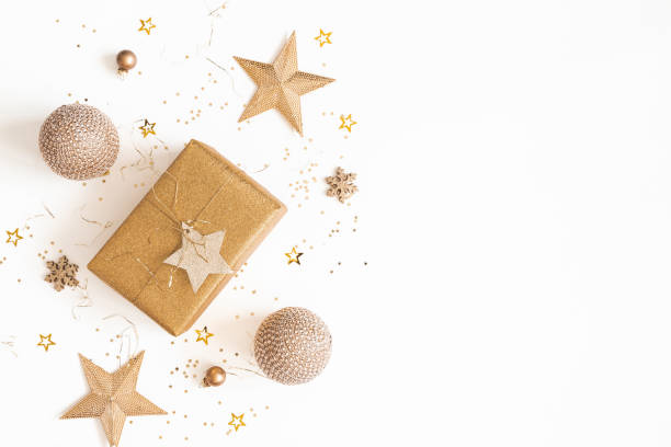istock Christmas composition. Gift box, golden decorations on white background. Christmas, winter, new year concept. Flat lay, top view, copy space 1179519626
