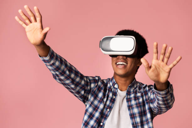 istock Happy teen guy enjoying virtual reality glasses experience 1179520910