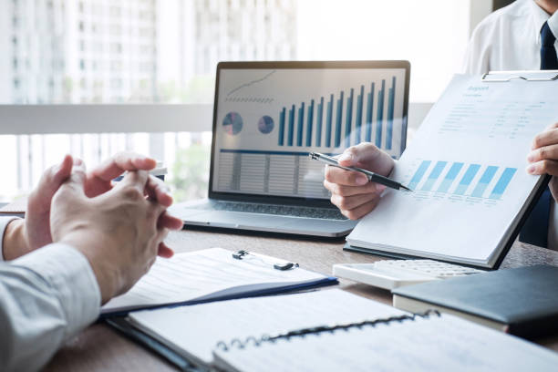 istock Business Colleagues Working At Desk In Office 1179521056