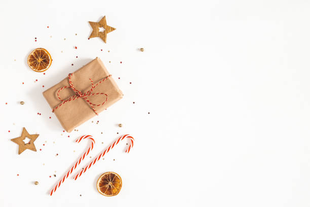 istock Christmas composition. Gift box, golden decorations on white background. Christmas, winter, new year concept. Flat lay, top view, copy space 1179521514