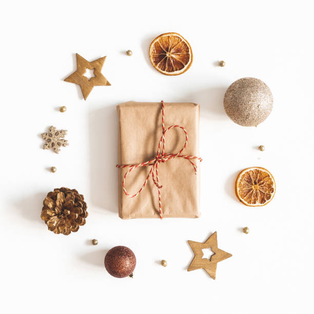 istock Christmas composition. Gift box, golden decorations on white background. Christmas, winter, new year concept. Flat lay, top view 1179521625