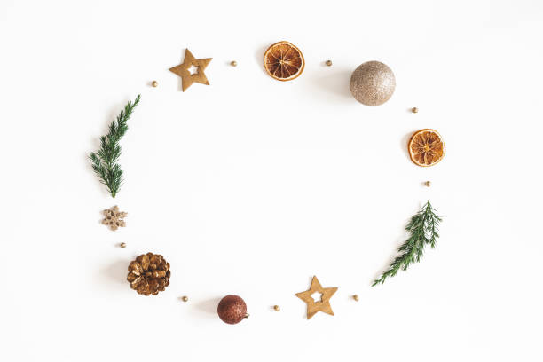istock Christmas composition. Wreath made of fir tree branches, golden decorations on white background. Christmas, winter, new year concept. Flat lay, top view, copy space 1179521661