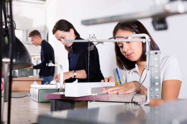 istock Female architect working on fret saw 1179523172