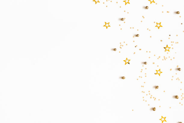 istock Christmas composition. Christmas golden confetti on white background. Flat lay, top view, copy space 1179523407