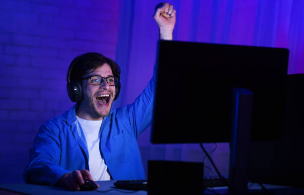 istock Delighted man winning the computer game, free space 1179523908