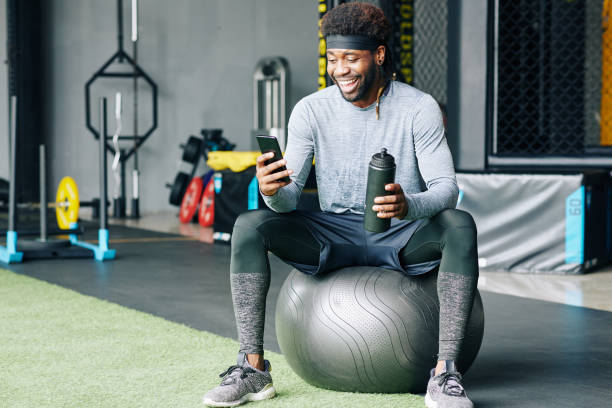 istock Happy fit man checking social media 1179525566