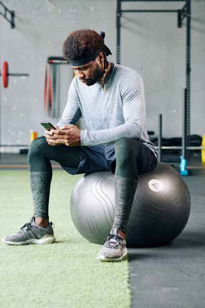 istock Sportsman reading recommendations from his coach 1179525612