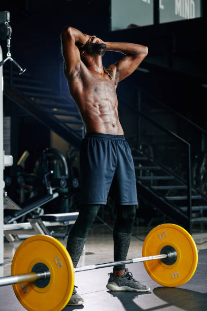 istock Happy sportsman after lifting barbell 1179525676