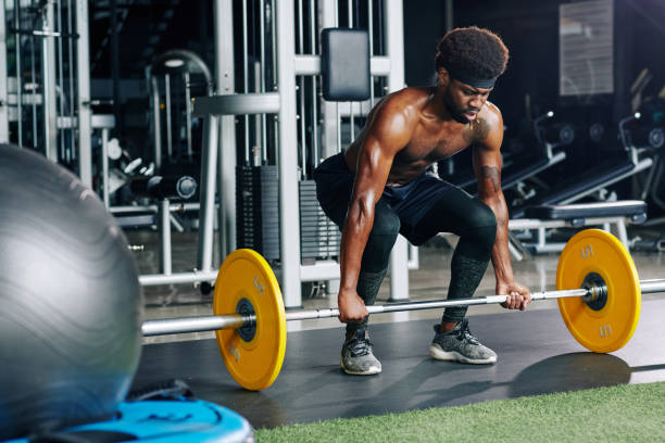 istock Sportsman working out with heavy weight 1179525731