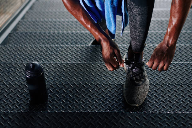 Athlete tying shoe laces