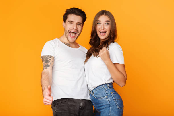 istock Happy couple rejoicing success, exclaiming with triumph 1179526674