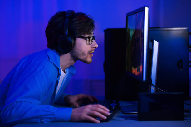 istock Addicted man playing video game at home 1179526758