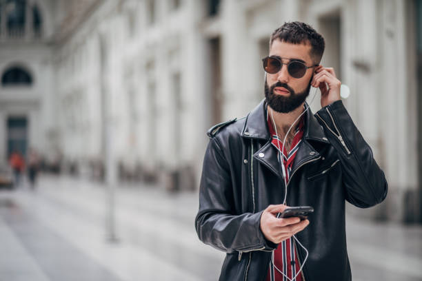 istock Modern young man listening music 1179526996