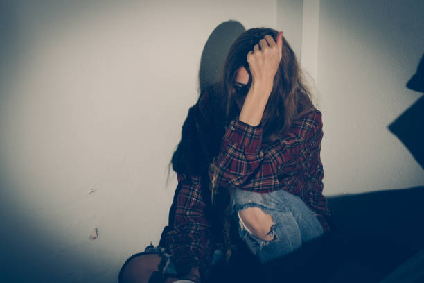 istock Depressed woman covering her face 1179527108