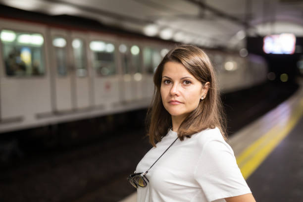 istock Woman waiting subway car on platform 1179527291