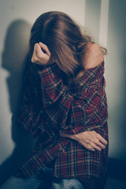 istock Depressed woman covering her face 1179527347