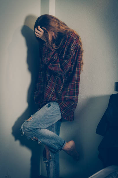istock Depressed woman covering her face 1179527390