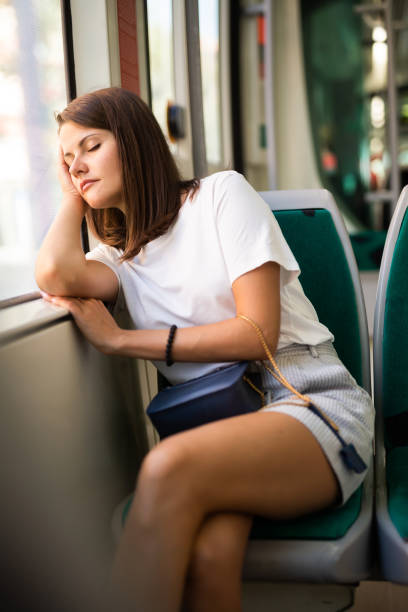 istock Woman sleeping in modern streetcar 1179527506