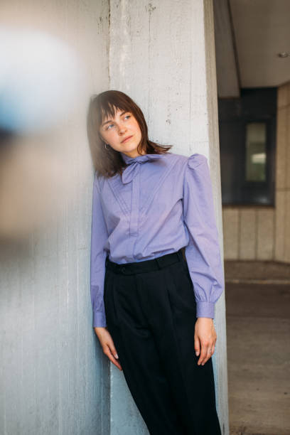 istock Thoughtful Woman Standing By Wall 1179527791