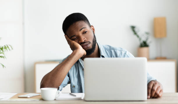 istock Bored employee sitting in office can not concentrate on work 1179528047