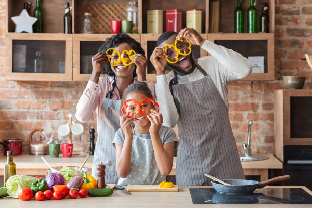 istock Sweet afro family having fun at kitchen 1179528421