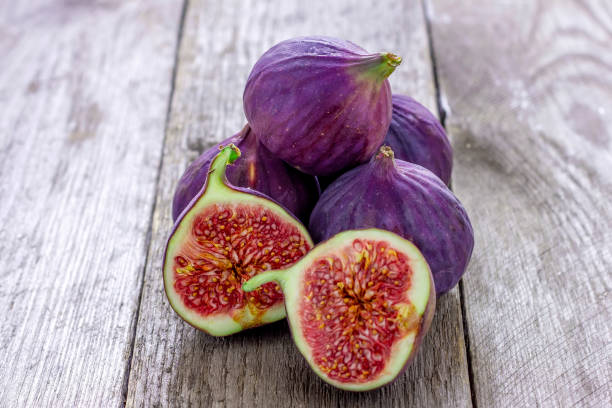 istock A fresh figs on old wooden background. 1179531069