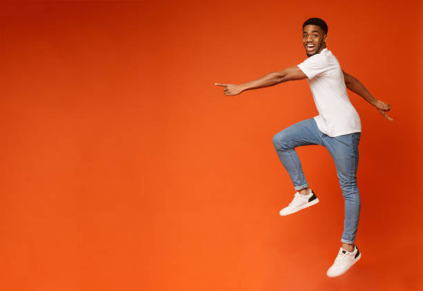 istock Excited african american guy walking in air 1179531232