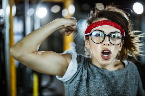 Muscular fit woman working with chain