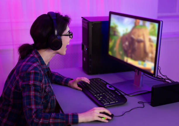istock Addicted female gamer playing game online on computer 1179533003