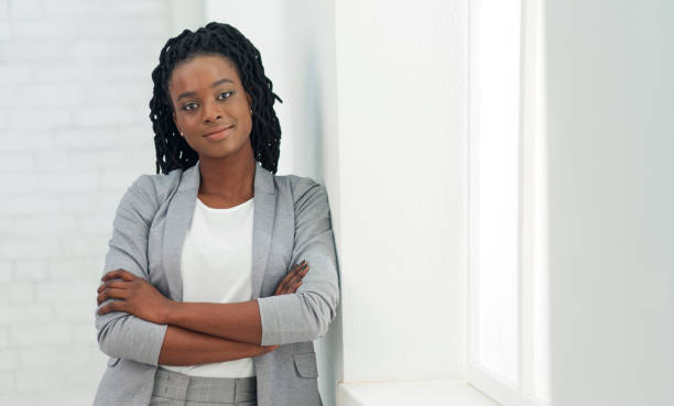 istock Young Black Lady Looking At Camera Standing In Office 1179535633