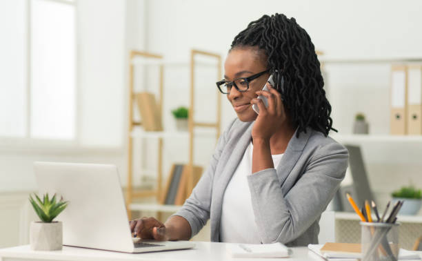 istock Black Entrepreneur Girl Talking On Cellphone In Office 1179536482