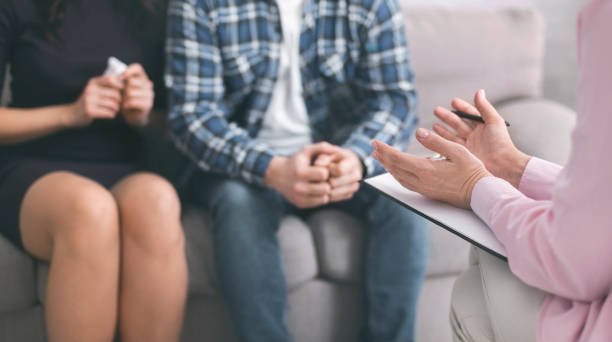 istock Psychotherapist talking with patients, discussing problems of their family 1179536806