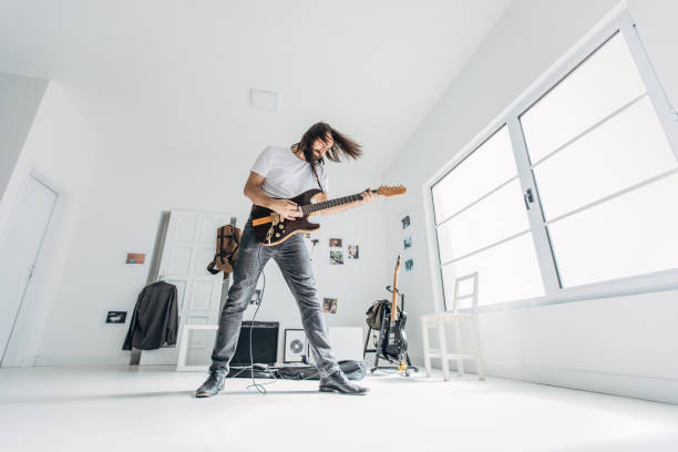 istock Handsome musician playing guitar 1179538528