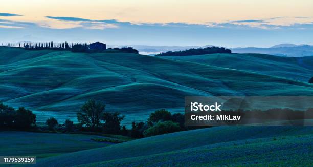 Sunrise Over Curvy Hills In Tuscany Stock Photo - Download Image Now - Blue, Fog, Hill