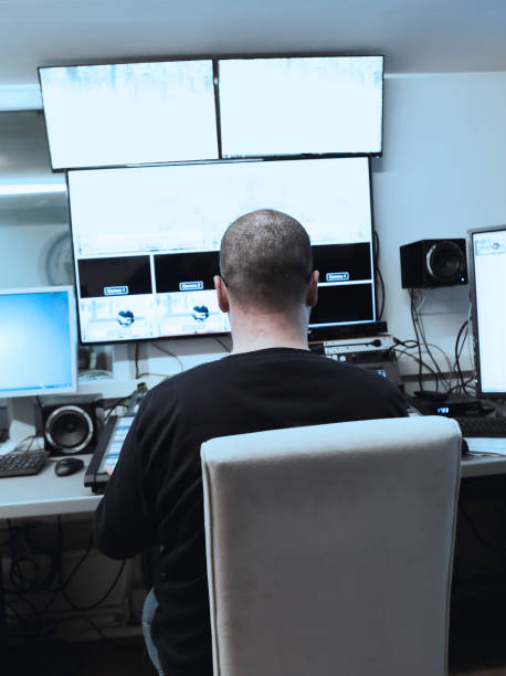 istock Rear View Of Tv Editor Working With Video Mixer At Workspace 1179539943