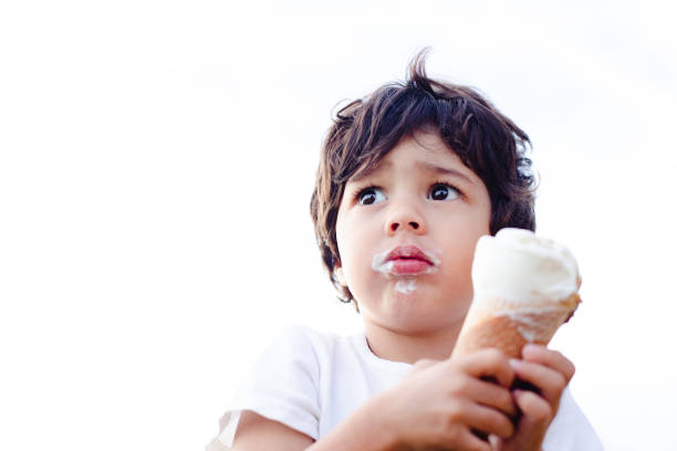 istock A cute and beautiful small child eating an ice cream 1179543174