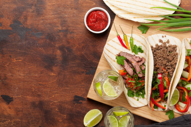 istock Mexican tacos and caipirinha cocktail 1179543478