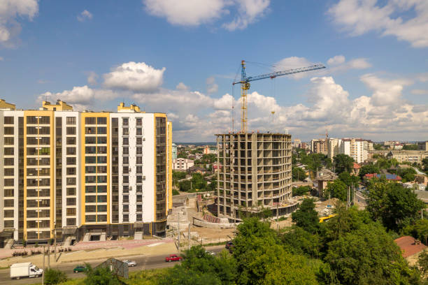 istock Apartment or office tall concrete building under construction. 1179544719