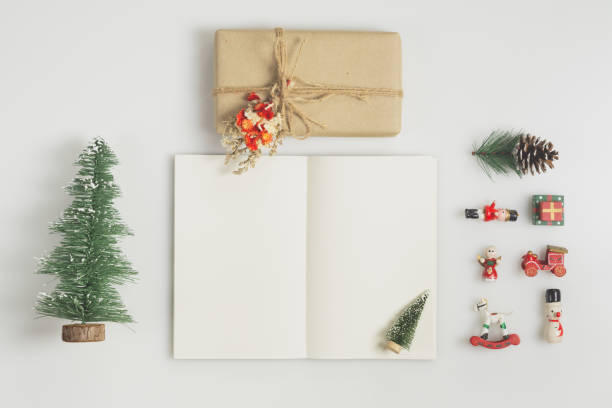 istock Handmade Gift box and notebook mock up with christmas ornaments on white  background 1179546754