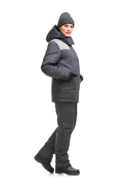 istock Female in gray working clothes and cap view 1179548155