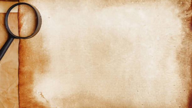 istock old paper texture with magnifying glass 1179550558